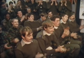 Soldiers watching the girls dancing'